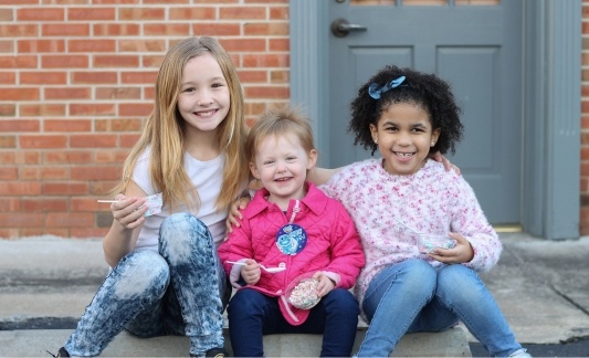 Dippin Dots kids enjoy on sidewalk