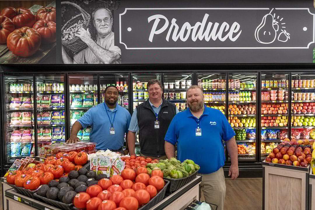 Isom IGA team members stand in the produce department