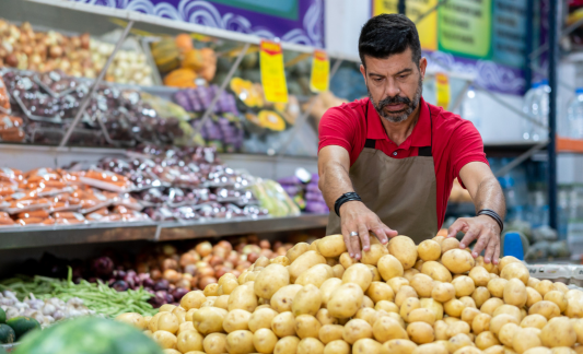 employee handling potatoes
