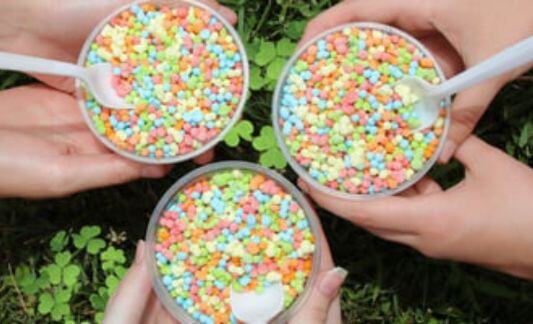three dippin dots cups held in a circle